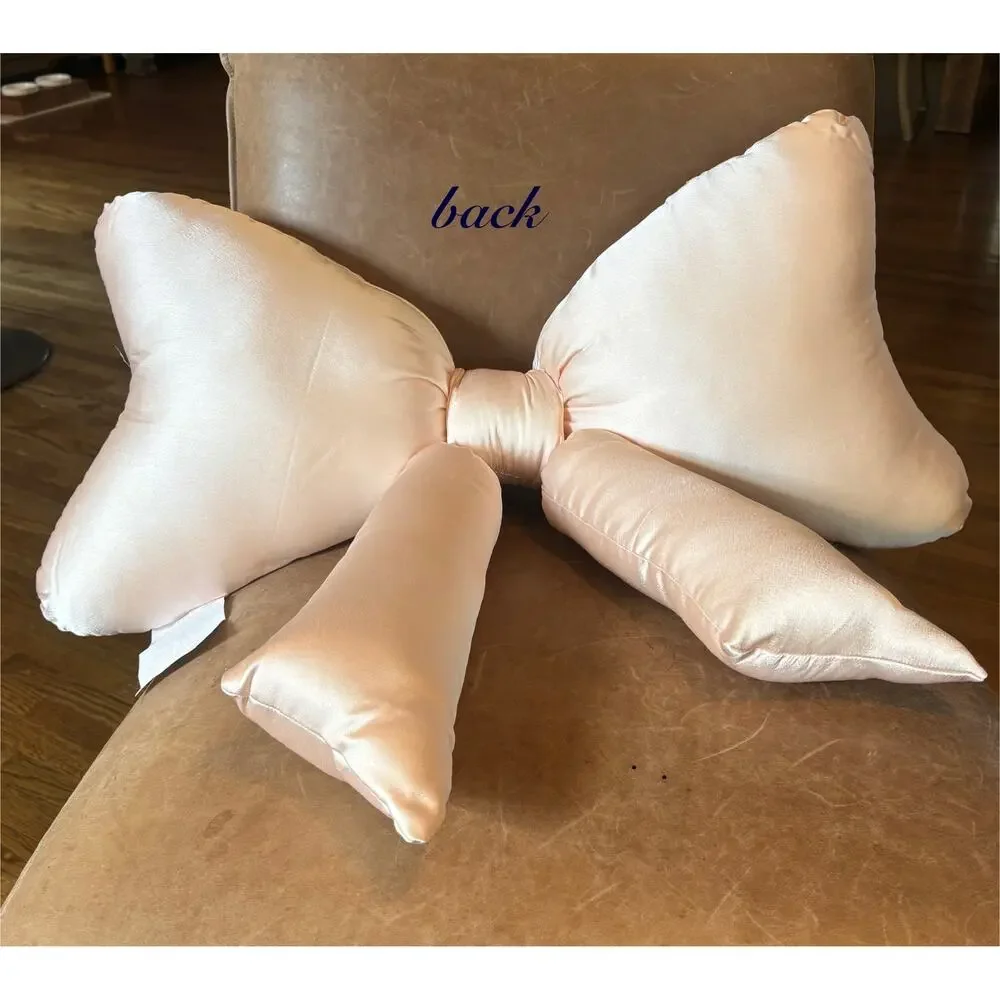 URBAN OUTFITTERS HOME light pink satin “BOW” throw pillow